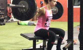 Young trainee box squatting.